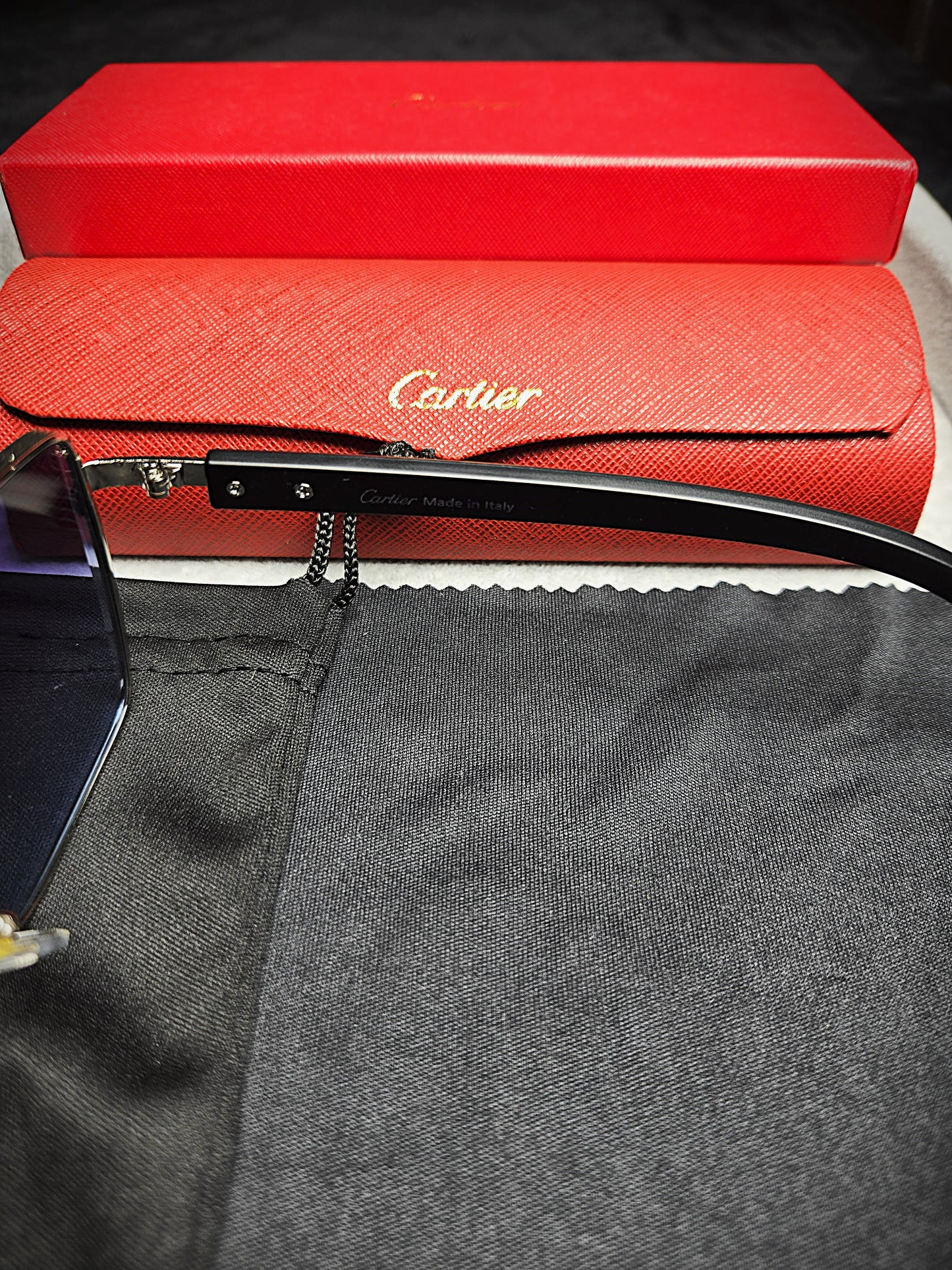 Cartier Black Frame Eyeglasses with Blue-Tinted Lenses